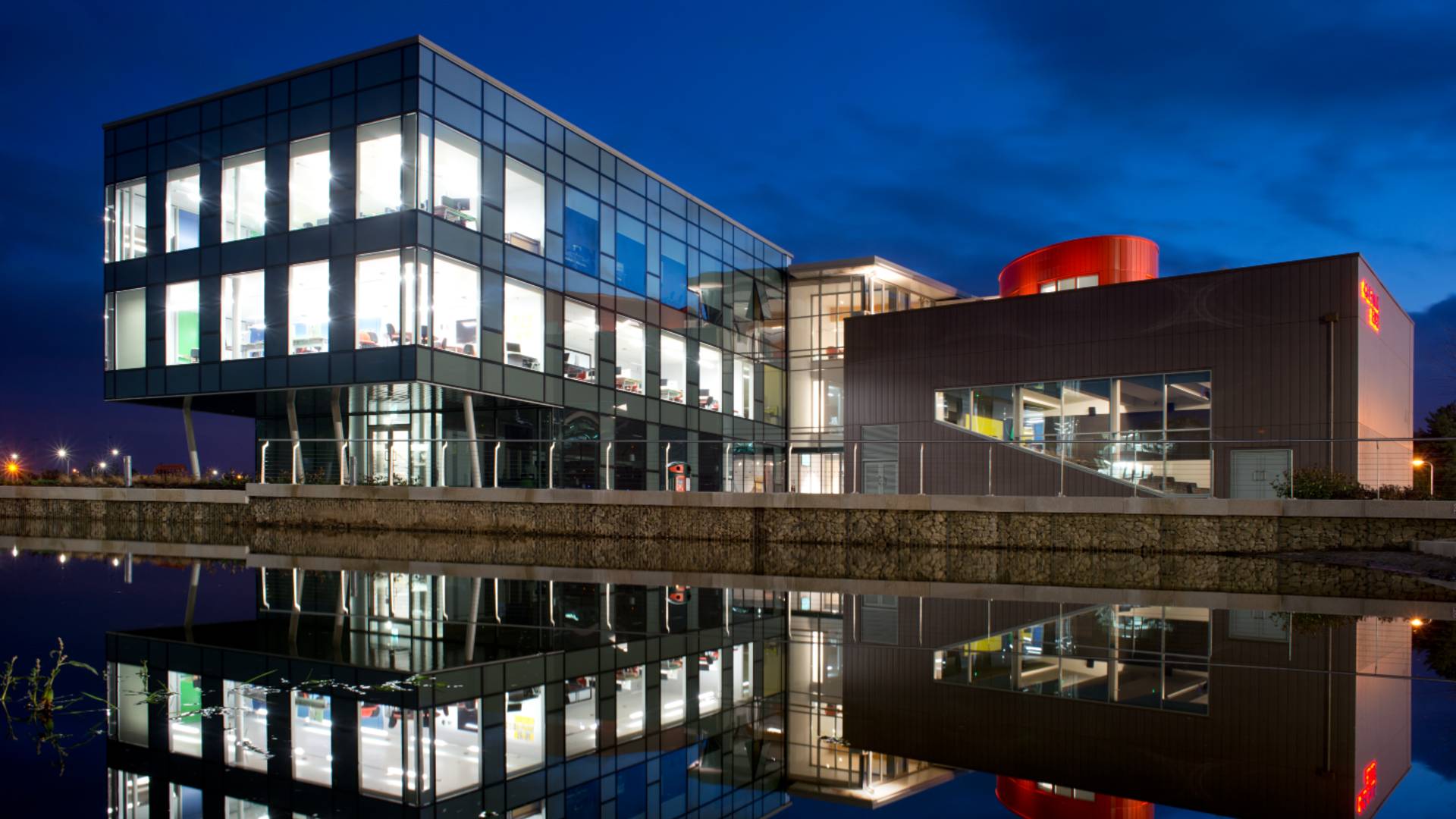 An external photo of Creative Edge taken at night.